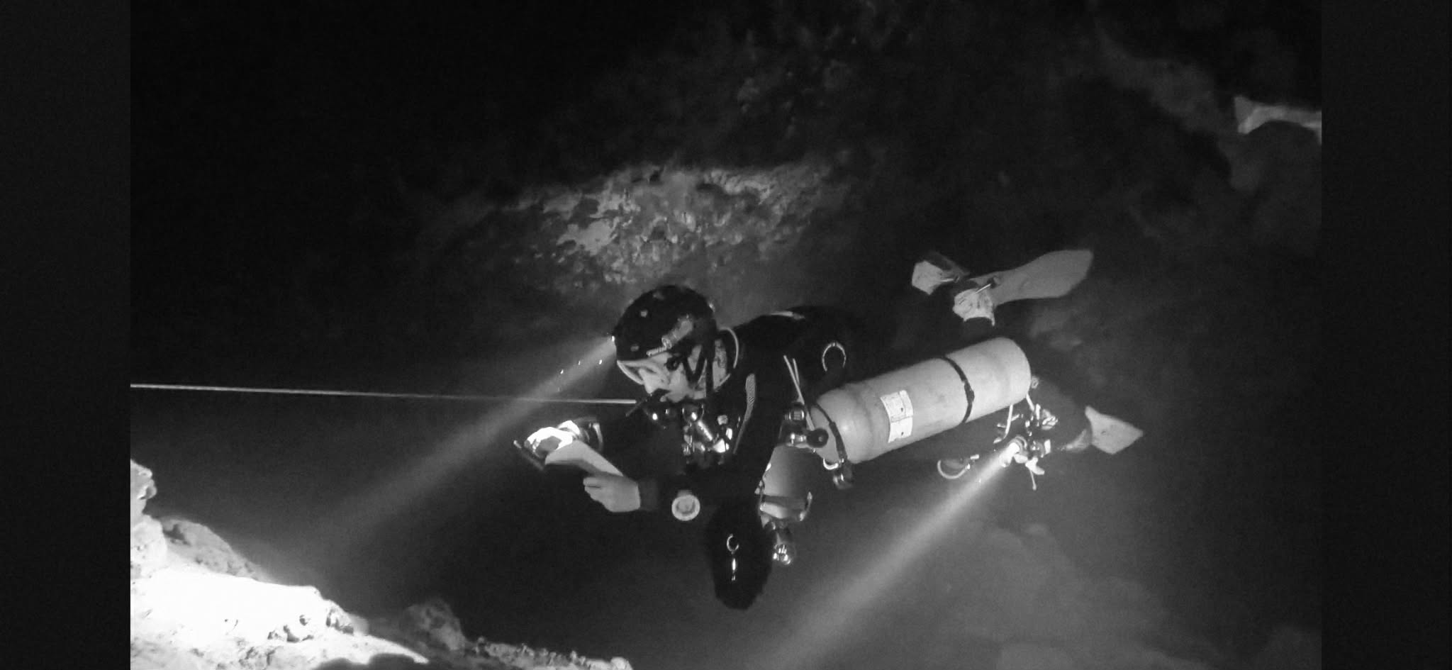 Diver on guideline in the dark
